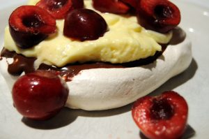 meringue with chocolate, lemon cream and cherries