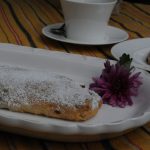 large and small stollen on the tray, a cup