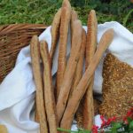 bread sticks and seed crackers in the basket