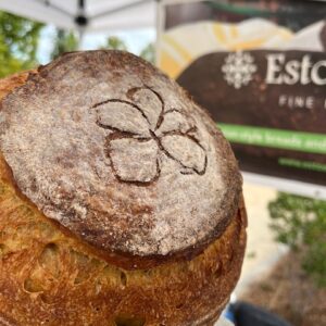 Kamut Sweet Potato sourdough bread loaf, EstoEtno Fine Bakery banner in the background